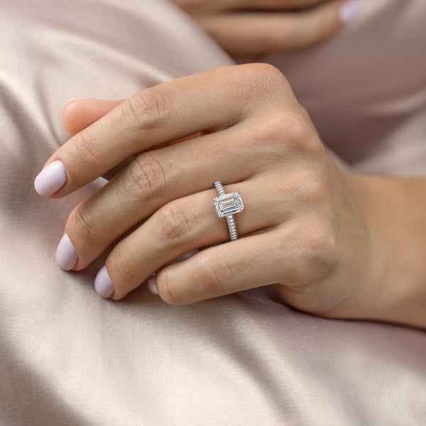 EMERALD CUT MOISSANITE PAVÉ SET SHOULDERS WITH HIDDEN HALO