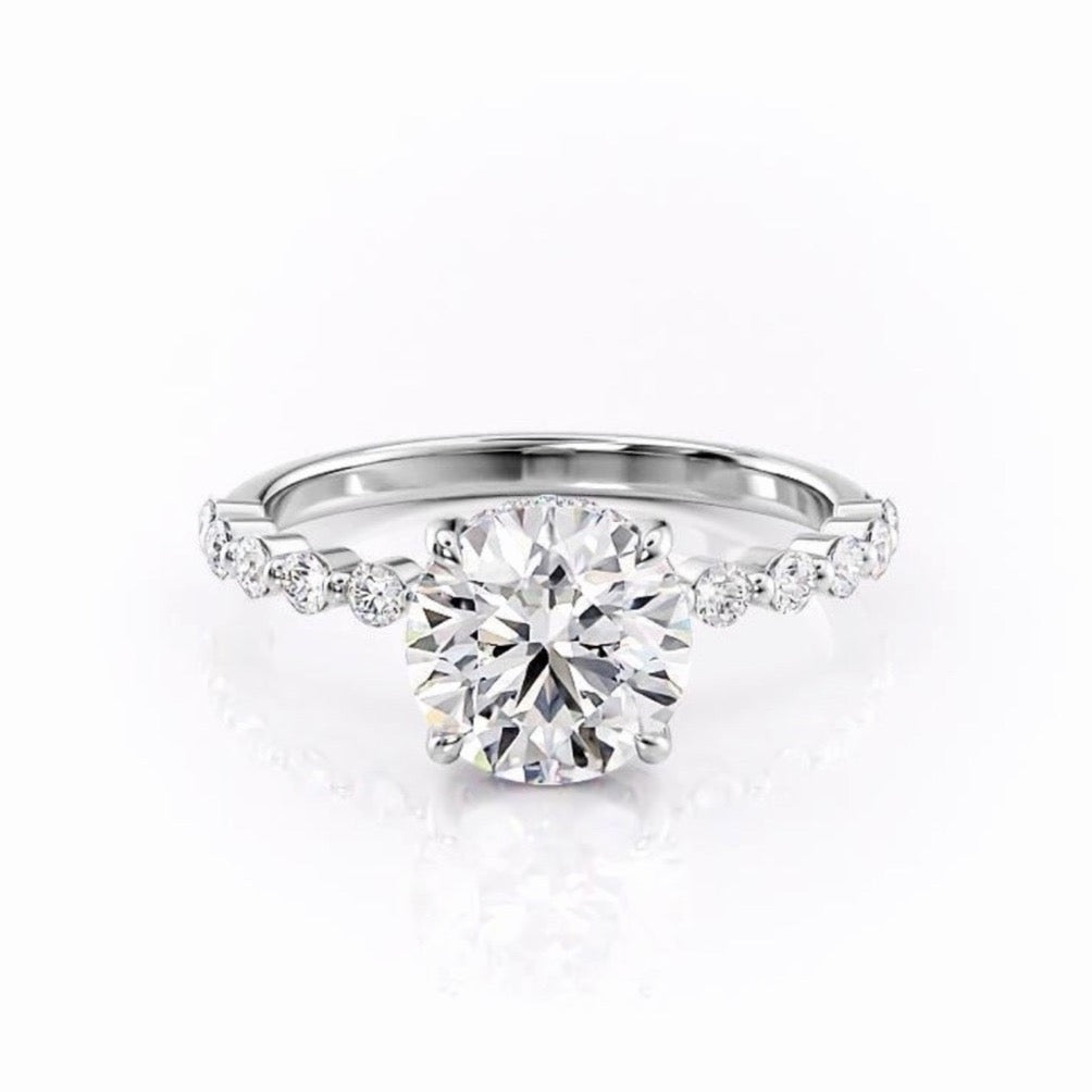 Round Cut Moissanite Shoulder Set Ring With Hidden Halo